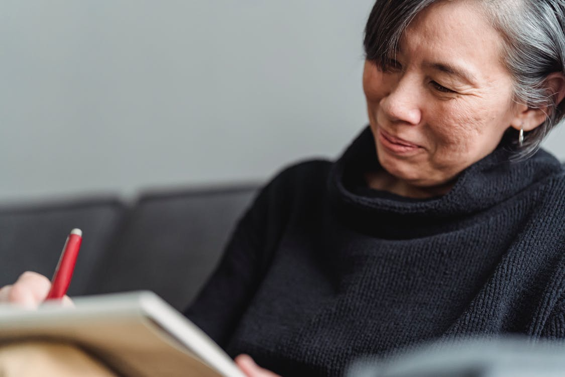 A render of three white cylindrical columns, against a warm creme background
