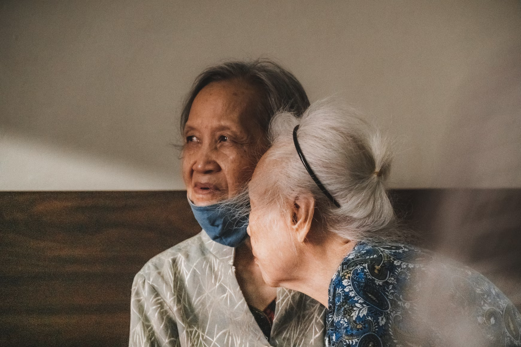 A render of three white cylindrical columns, against a warm creme background